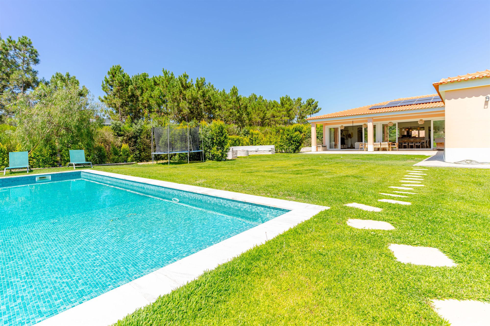 Swimming pool with stone walls